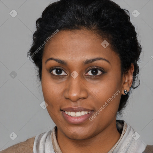 Joyful black young-adult female with short  brown hair and brown eyes