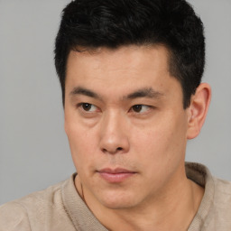 Neutral asian young-adult male with short  black hair and brown eyes