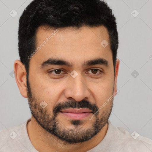 Joyful latino young-adult male with short  black hair and brown eyes