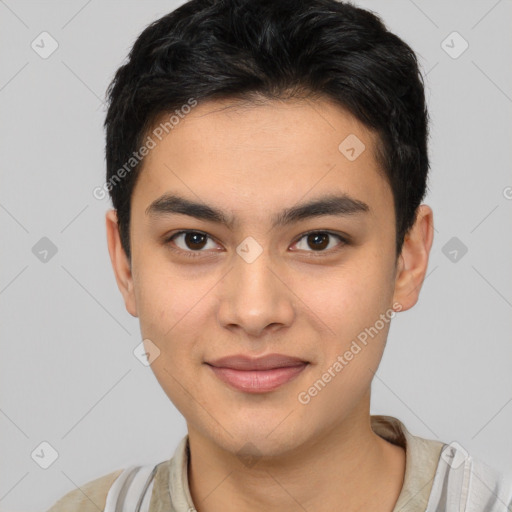 Joyful asian young-adult male with short  brown hair and brown eyes