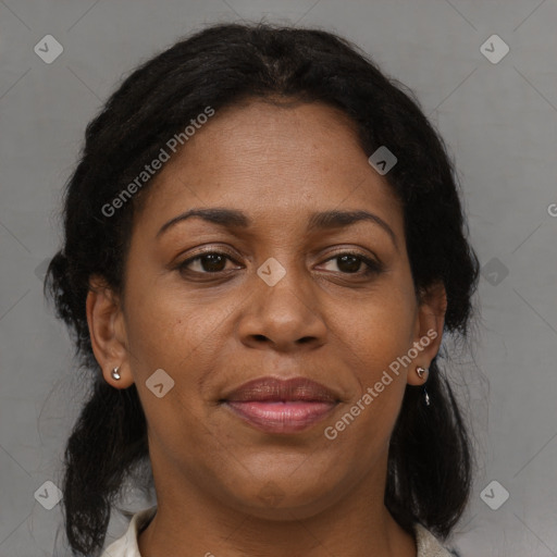 Joyful black adult female with medium  brown hair and brown eyes