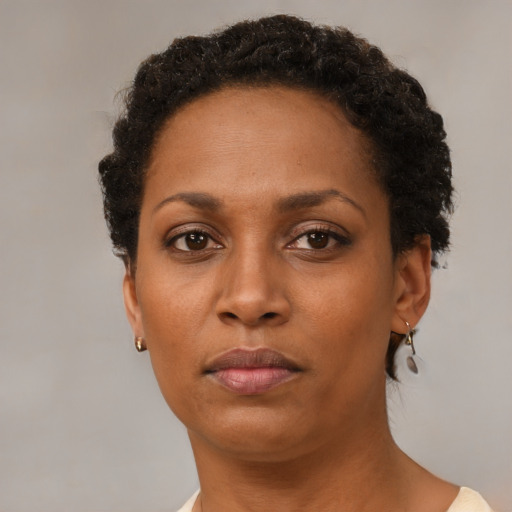 Neutral black adult female with short  brown hair and brown eyes