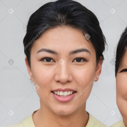 Joyful asian young-adult female with short  brown hair and brown eyes