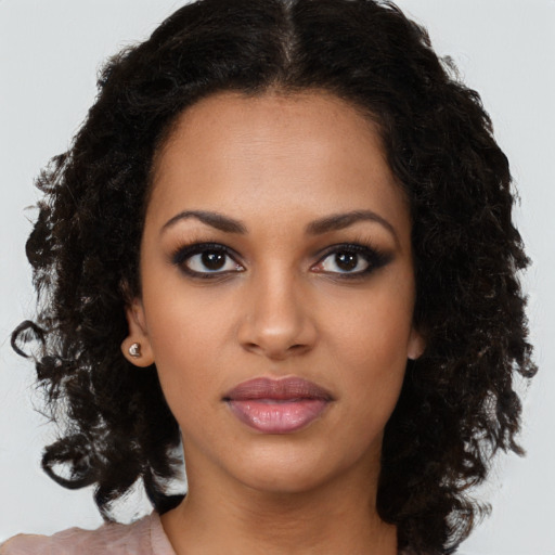 Neutral black young-adult female with long  brown hair and brown eyes