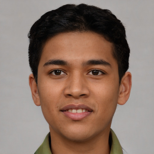 Joyful latino young-adult male with short  brown hair and brown eyes