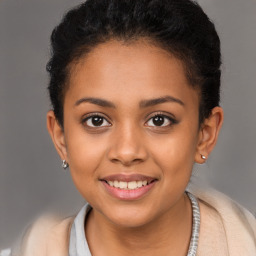 Joyful latino young-adult female with short  brown hair and brown eyes