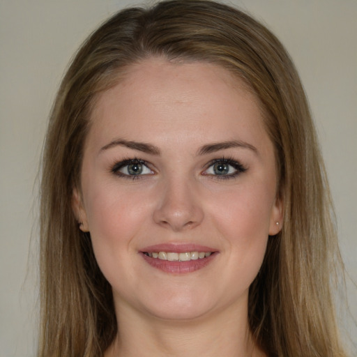 Joyful white young-adult female with long  brown hair and grey eyes