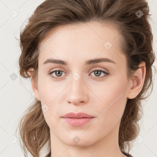 Joyful white young-adult female with long  brown hair and green eyes