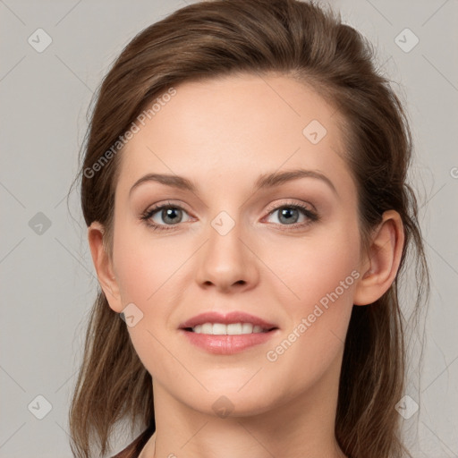 Joyful white young-adult female with long  brown hair and green eyes