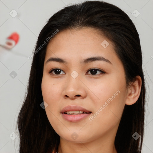 Joyful asian young-adult female with long  brown hair and brown eyes