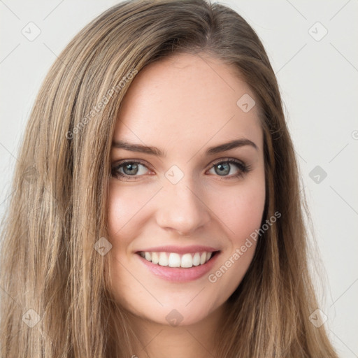 Joyful white young-adult female with long  brown hair and green eyes