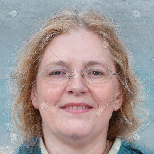 Joyful white adult female with medium  brown hair and blue eyes