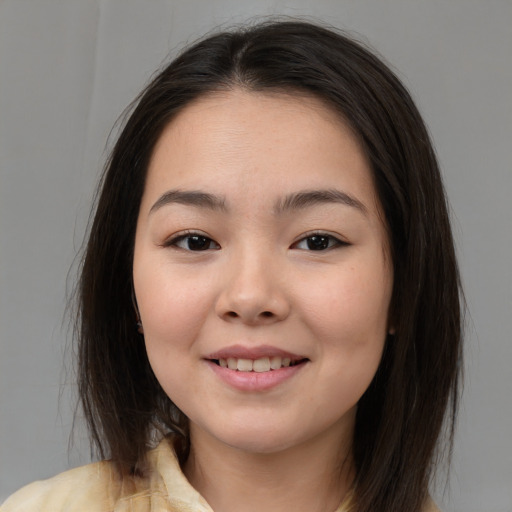 Joyful white young-adult female with medium  brown hair and brown eyes