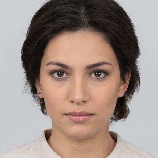 Neutral white young-adult female with medium  brown hair and brown eyes