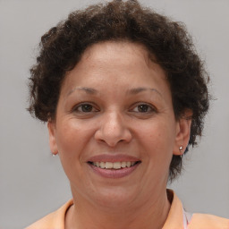 Joyful white adult female with short  brown hair and brown eyes