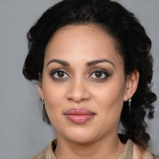 Joyful latino young-adult female with medium  black hair and brown eyes