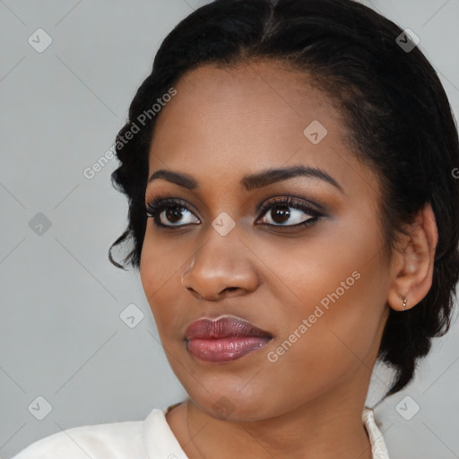 Joyful black young-adult female with medium  black hair and brown eyes