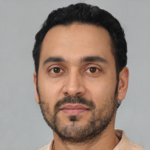 Neutral latino adult male with short  black hair and brown eyes