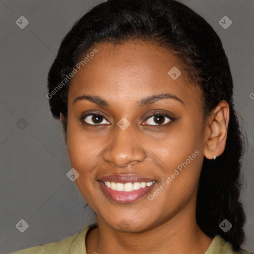 Joyful black young-adult female with short  brown hair and brown eyes