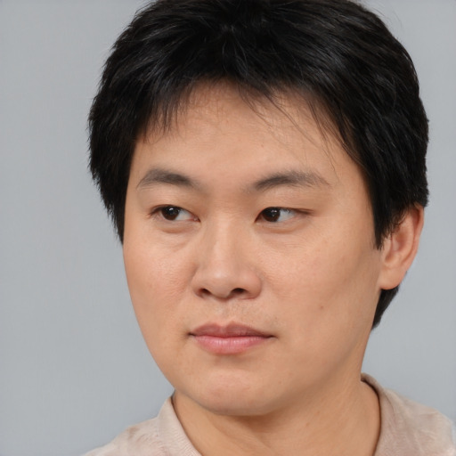 Neutral asian young-adult male with short  brown hair and brown eyes
