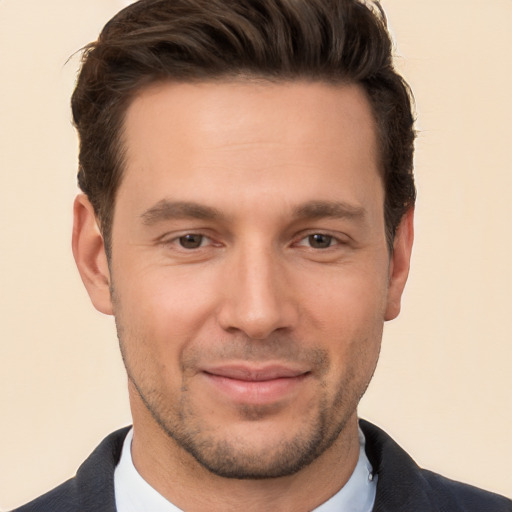 Joyful white young-adult male with short  brown hair and brown eyes