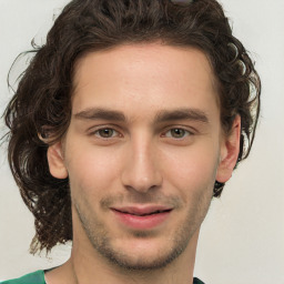 Joyful white young-adult male with medium  brown hair and brown eyes