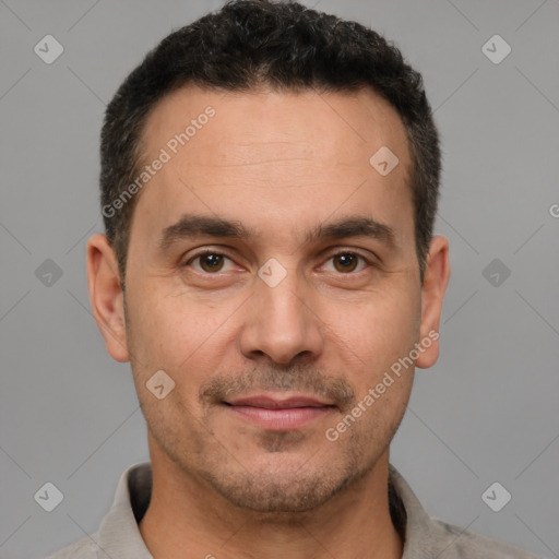 Joyful white adult male with short  brown hair and brown eyes