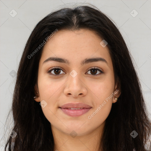 Joyful latino young-adult female with long  brown hair and brown eyes