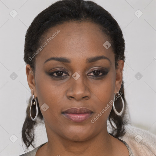 Joyful black young-adult female with short  black hair and brown eyes