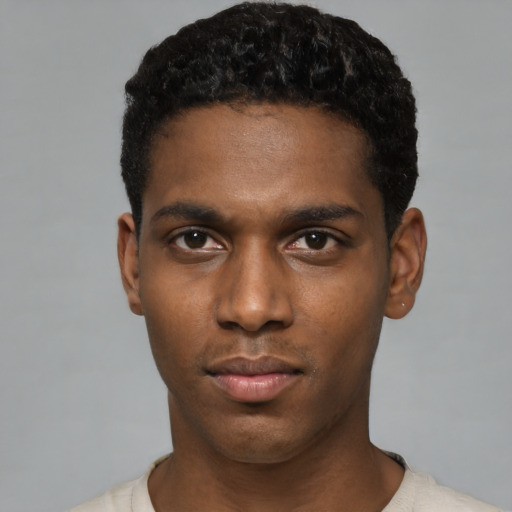 Neutral black young-adult male with short  black hair and brown eyes