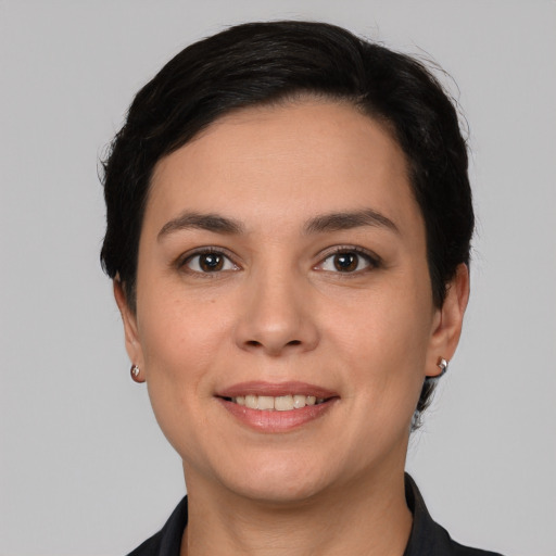 Joyful white young-adult female with short  brown hair and brown eyes