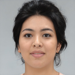 Joyful asian young-adult female with medium  black hair and brown eyes