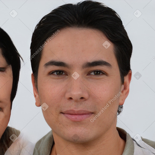 Joyful asian young-adult male with short  brown hair and brown eyes