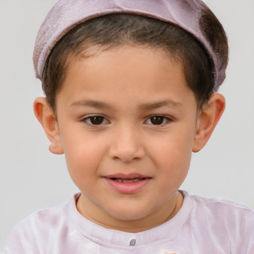 Joyful white child male with short  brown hair and brown eyes