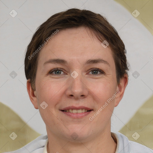 Joyful white adult female with short  brown hair and brown eyes