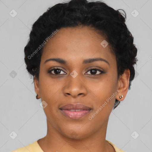 Joyful black young-adult female with short  black hair and brown eyes