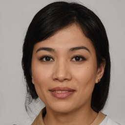 Joyful asian young-adult female with medium  black hair and brown eyes