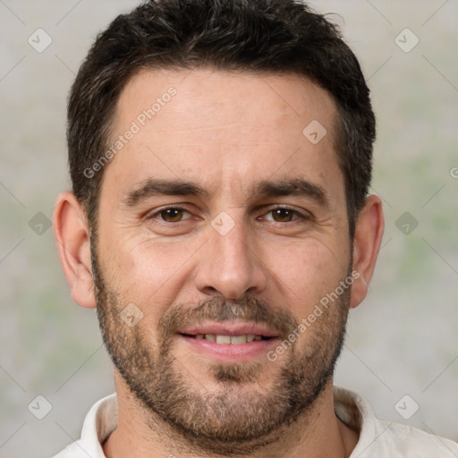 Joyful white adult male with short  brown hair and brown eyes