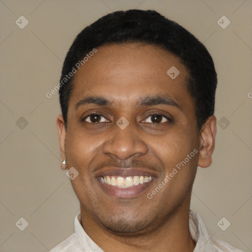 Joyful latino young-adult male with short  black hair and brown eyes