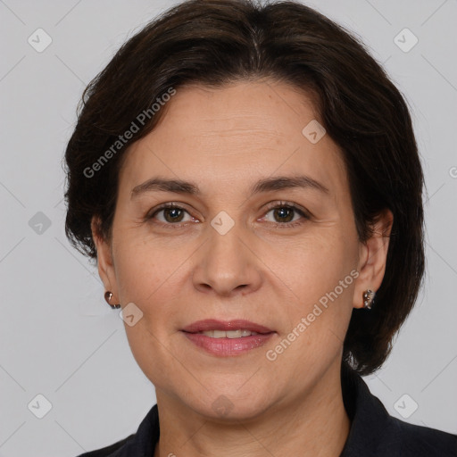 Joyful white adult female with medium  brown hair and brown eyes