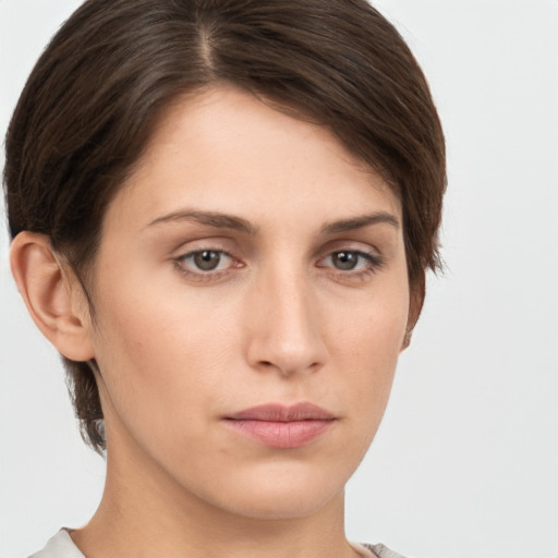 Neutral white young-adult female with short  brown hair and brown eyes