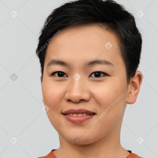 Joyful asian young-adult female with short  brown hair and brown eyes