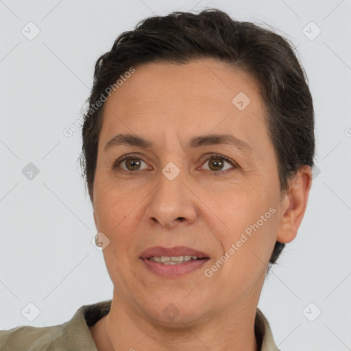 Joyful white adult female with short  brown hair and brown eyes