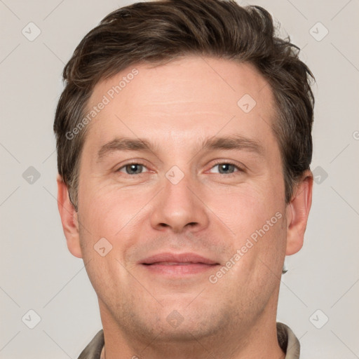 Joyful white adult male with short  brown hair and grey eyes