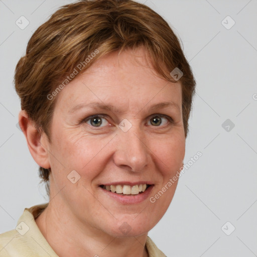 Joyful white adult female with medium  brown hair and grey eyes