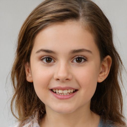 Joyful white child female with medium  brown hair and brown eyes