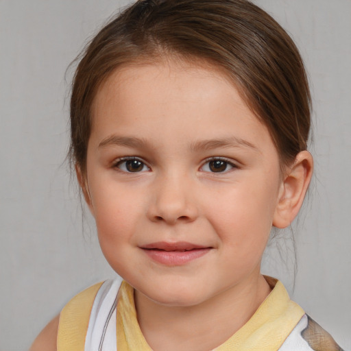 Joyful white child female with medium  brown hair and brown eyes