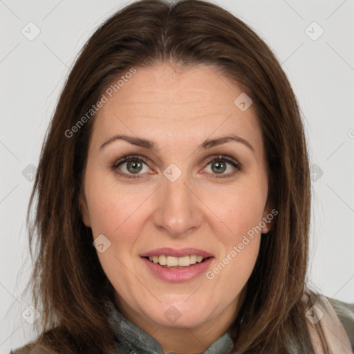 Joyful white adult female with long  brown hair and brown eyes