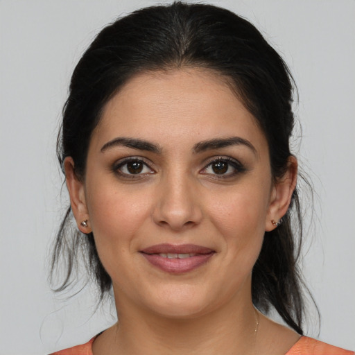 Joyful white young-adult female with medium  brown hair and brown eyes