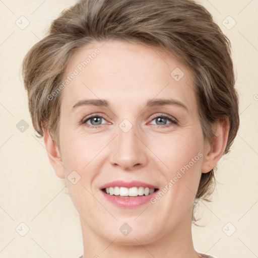 Joyful white young-adult female with medium  brown hair and green eyes